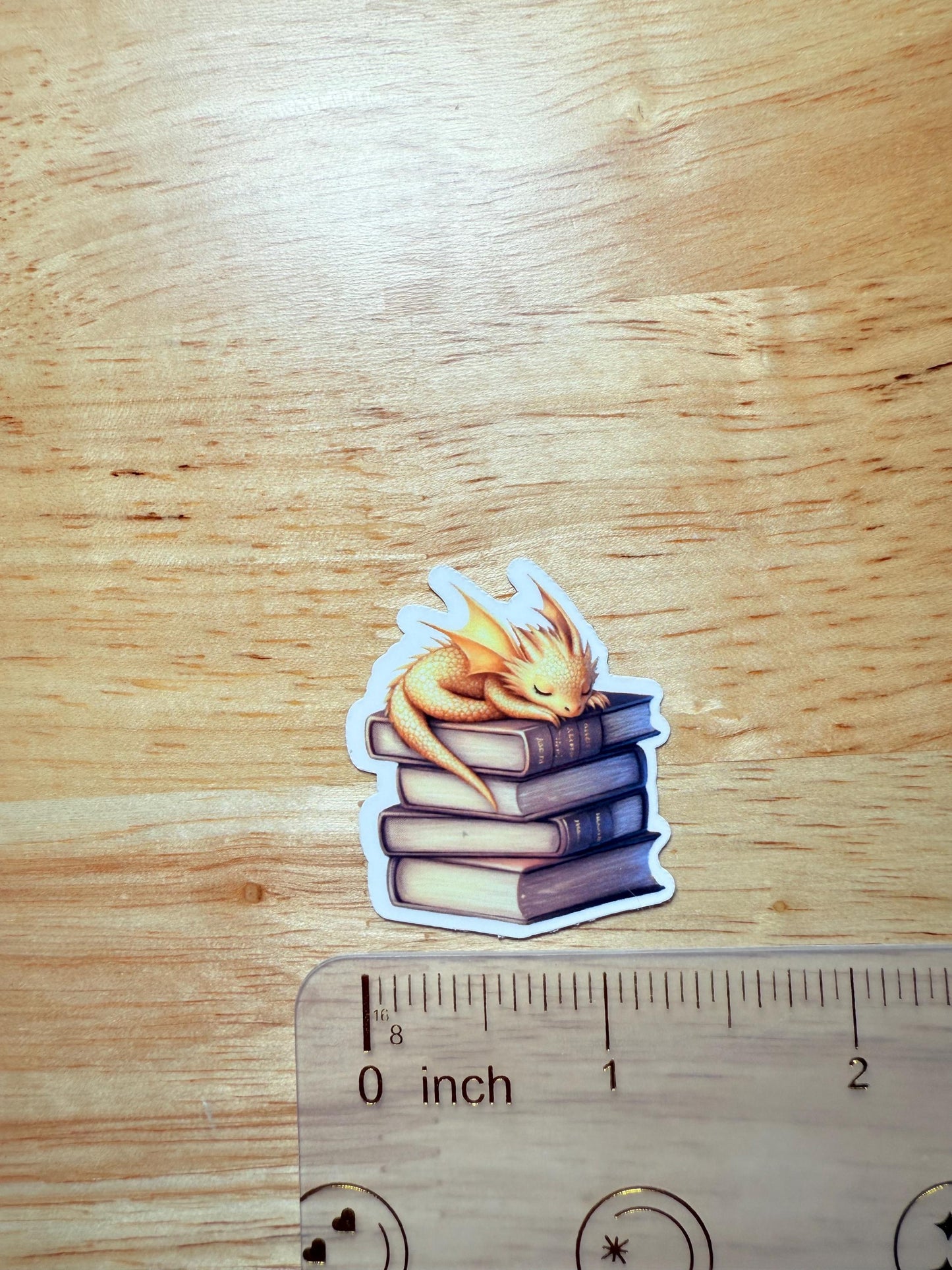 Andarna Inspired Dragon Sticker | Gold Dragon Sleeping on Books Vinyl Decal | Romantasy Booktok Gift | Cozy Fantasy Reader Laptop Sticker | Book Lover Accessory - The Sticker Era