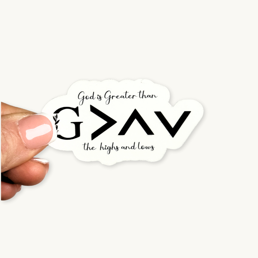 God is bigger than the highs and lows sticker shown on a laptop
