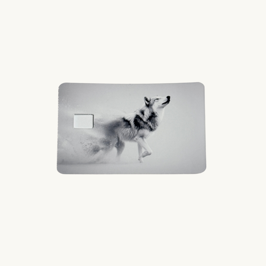 "Running wolf in fading mist debit card skin, grey wild animal decal for credit cards.
