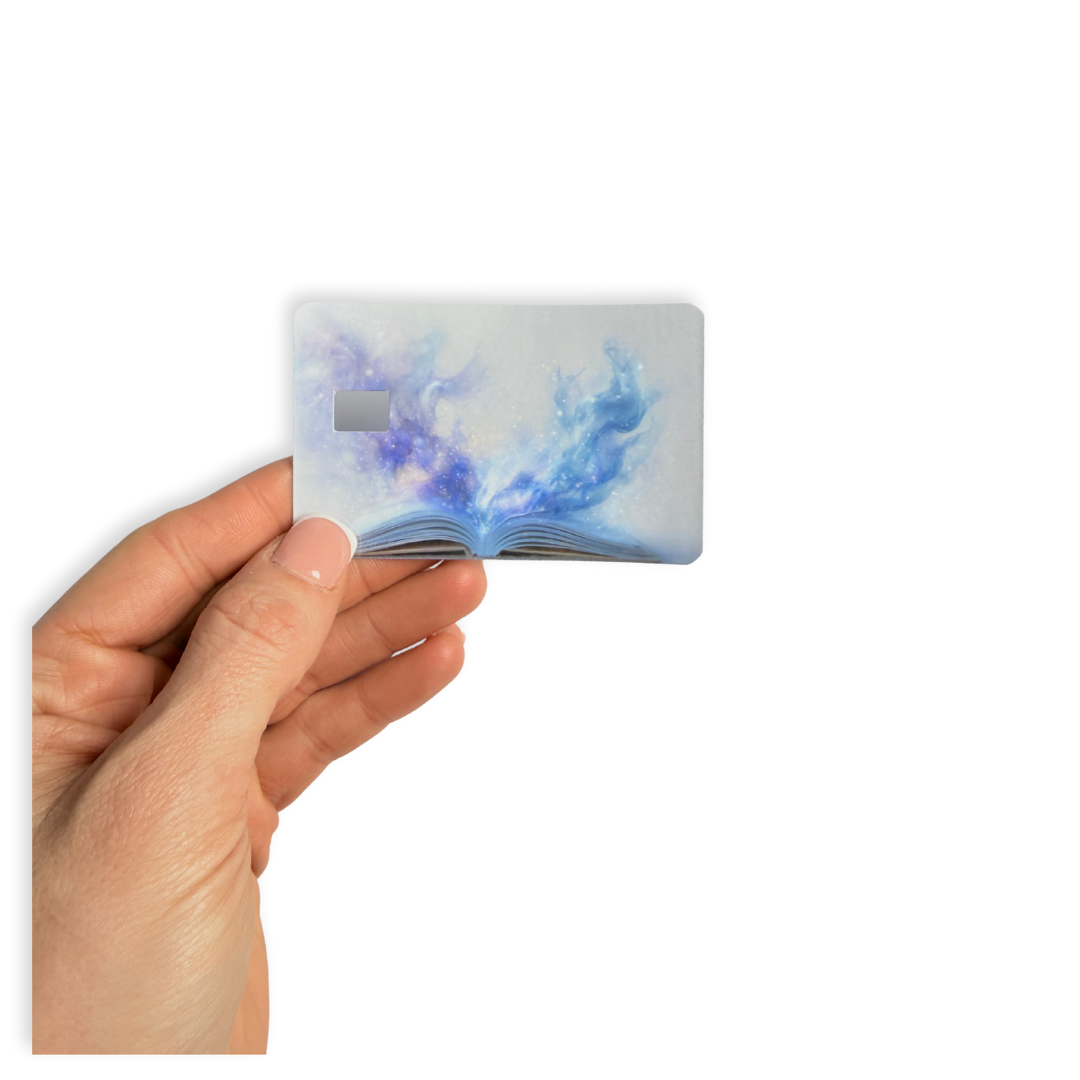 Dreamy fantasy aesthetic card cover, open book releasing blue galaxy magic mist design."