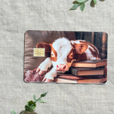 Cozy Bookish Baby Cow Card Skin | Sleepy Cow on Books by The Sticker Era