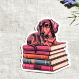 Dachshund on Books Sticker | Cute Bookish Dog Vinyl Decal by The Sticker Era