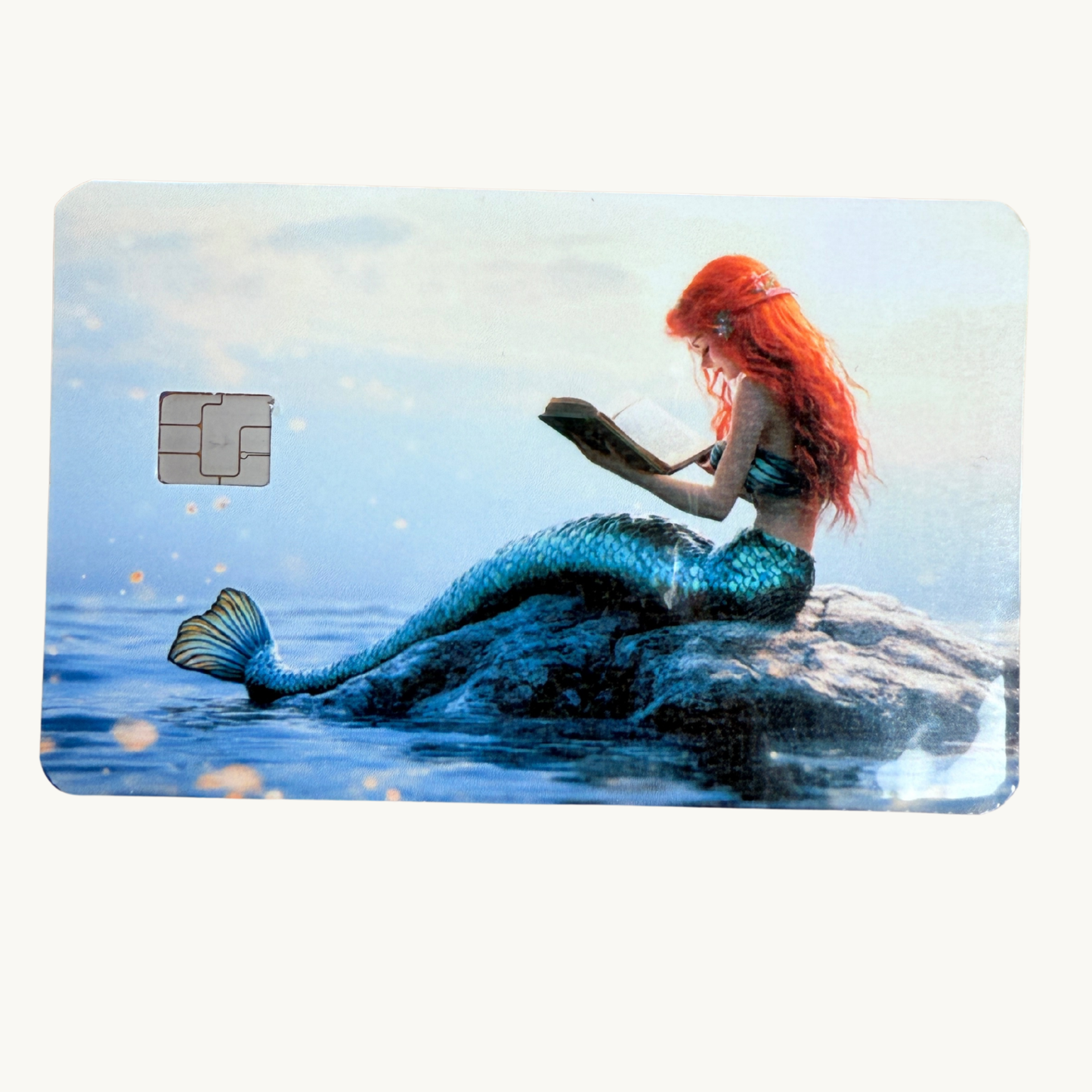 Reading mermaid card skin with redhead mermaid and octopus, fantasy ocean book lover decal by The Sticker Era
