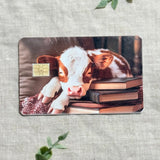 Cozy Bookish Baby Cow Card Skin | Sleepy Cow on Books by The Sticker Era
