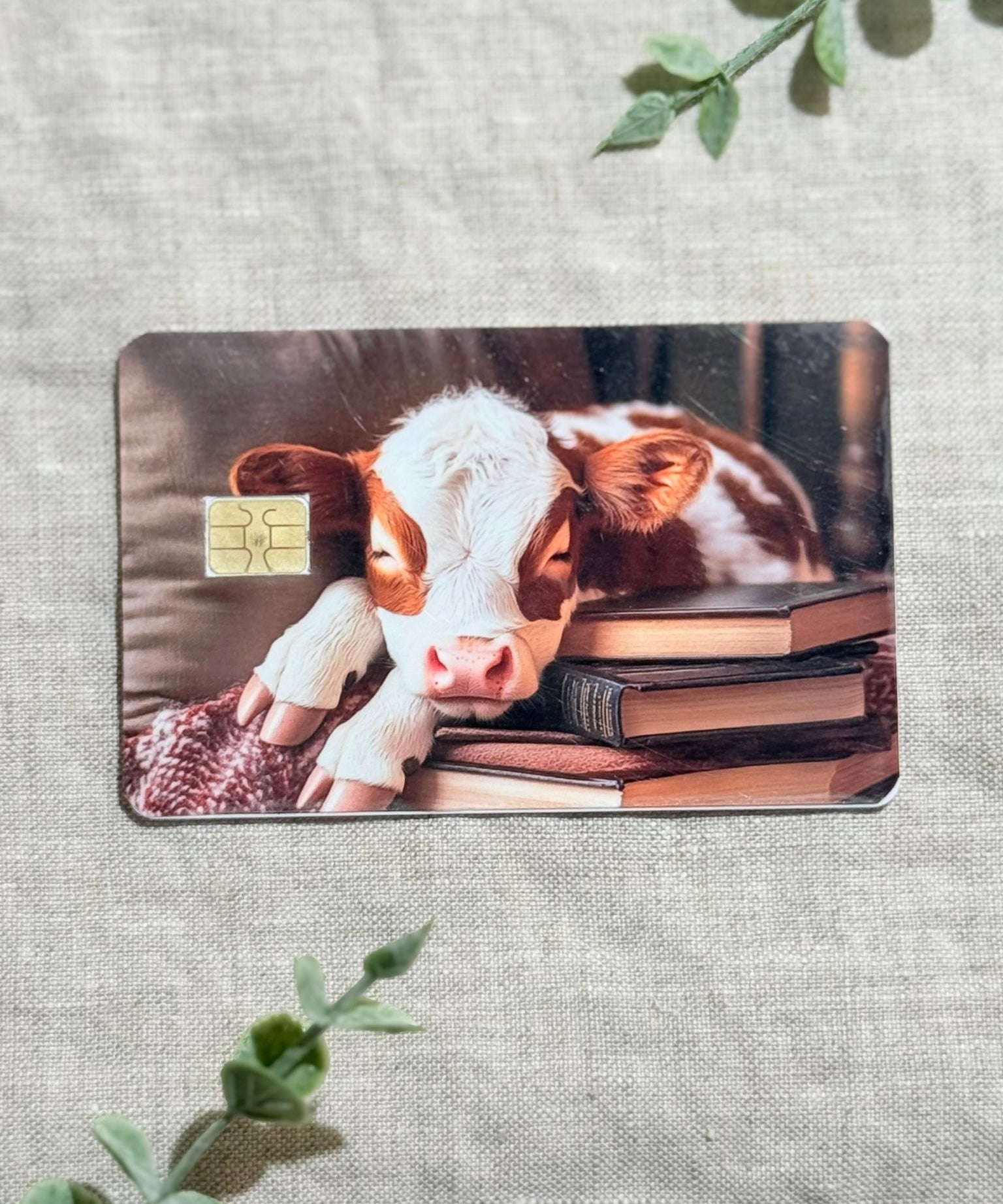 Cozy Bookish Baby Cow Card Skin | Sleepy Cow on Books by The Sticker Era