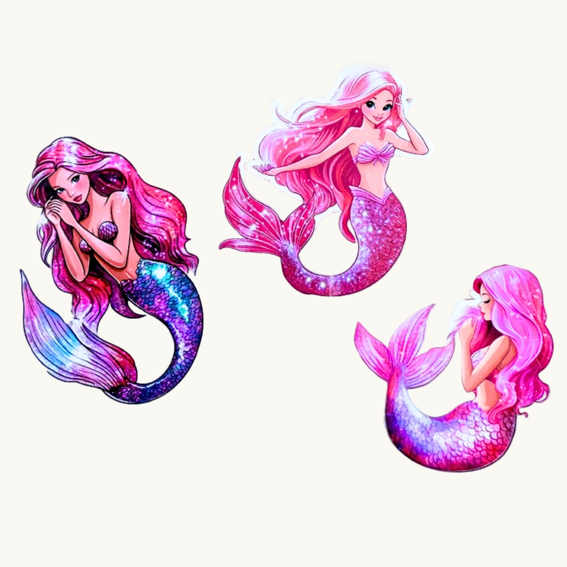 three pink mermaids, sparkling. 