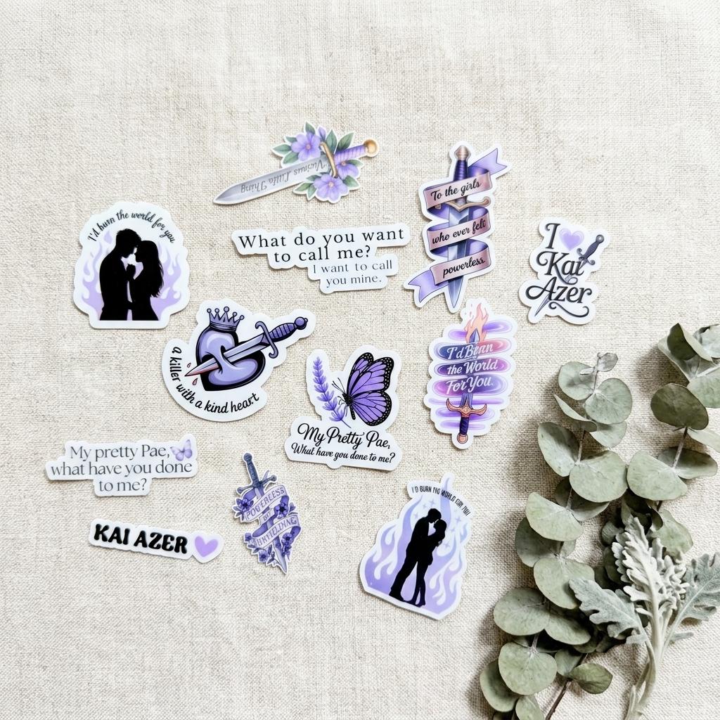 The full set of 12 book boyfriend stickers laid out flat on natural linen fabric with a fresh eucalyptus sprig. Purple and lavender vinyl decals include a couple silhouette in flames, a crowned heart with dagger, a butterfly, a floral dagger, romantic book quotes, and the name Kai Azer. __etsy:8133863376