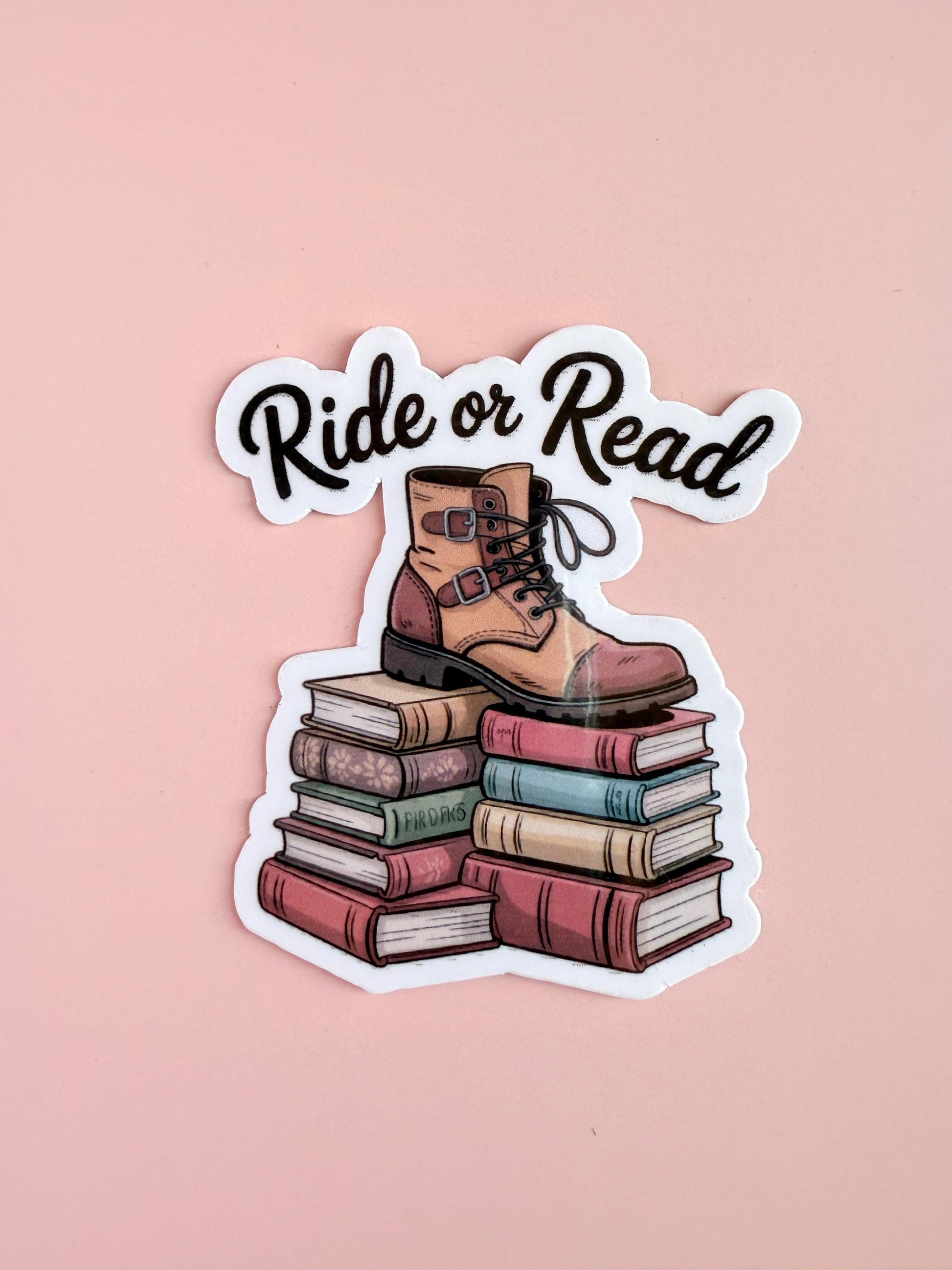 A romantasy-inspired sticker featuring a pair of rugged boots standing on top of stacked books, with bold text that reads “Ride or Die.” Designed in a moody, fantasy aesthetic, perfect for fans of Fourth Wing, bookish girls, and dragon rider vibes. __etsy:6869526684
