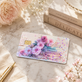 Pastel floral book card skin on white marble with pale roses, a book and baby's breath in sunlight by The Sticker Era