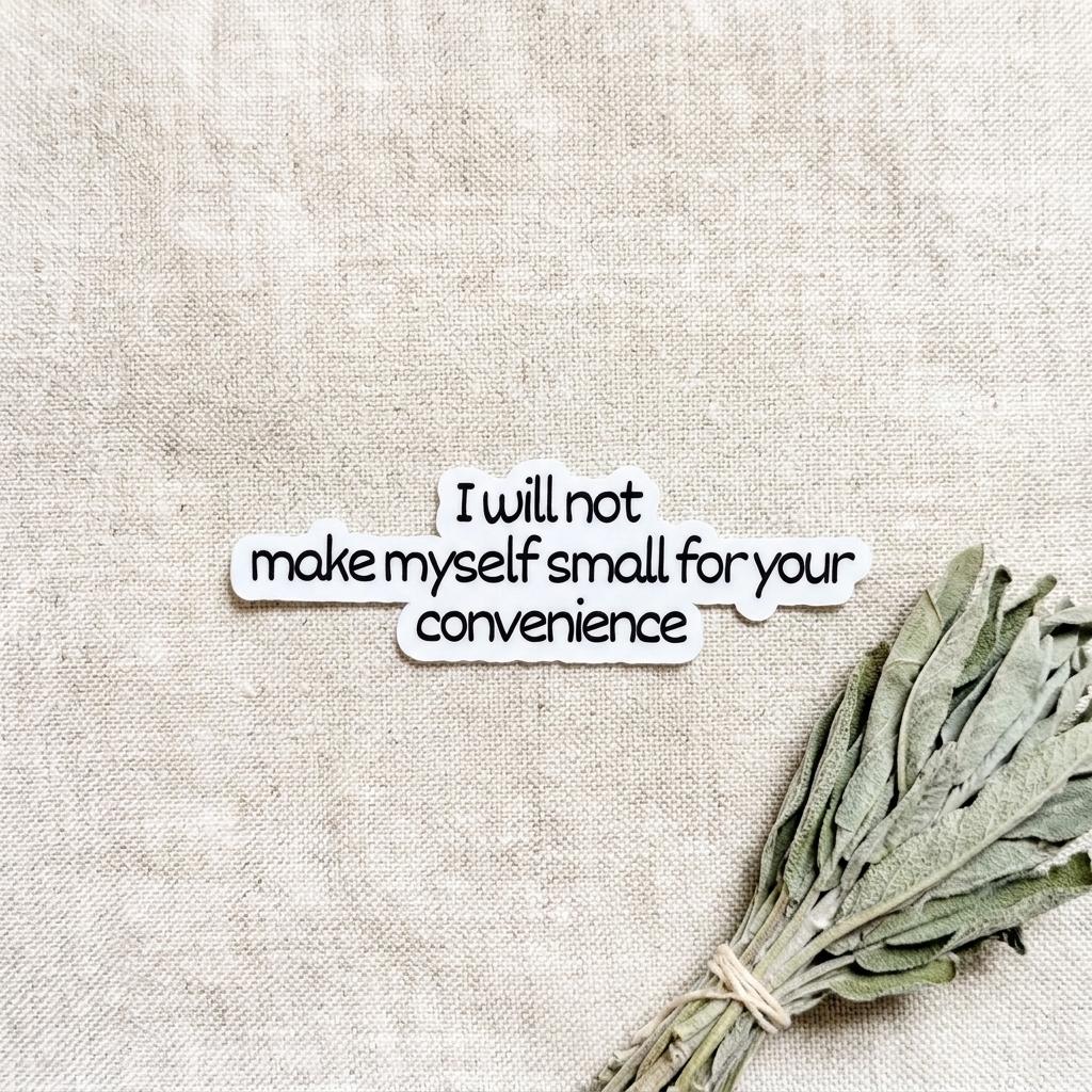 sticker on a cloth beside a green sage plant that says "i will not make myself small for your convenience. __etsy:8181720347