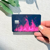 Hot pink flame card skin held up to show holographic glitter shimmer by The Sticker Era