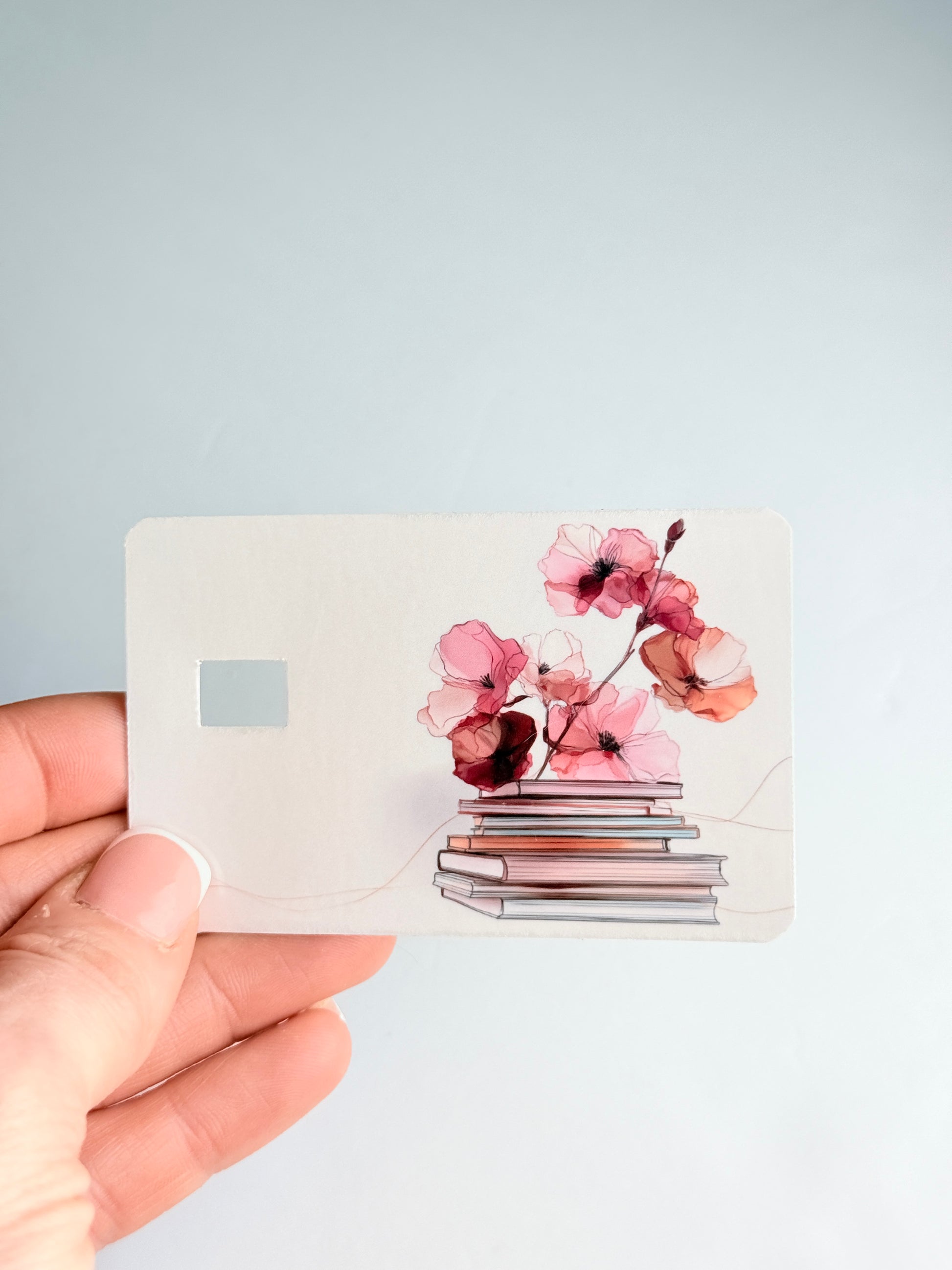 Cute gift for librarians and bookworms, floral book stack credit card decoration."
