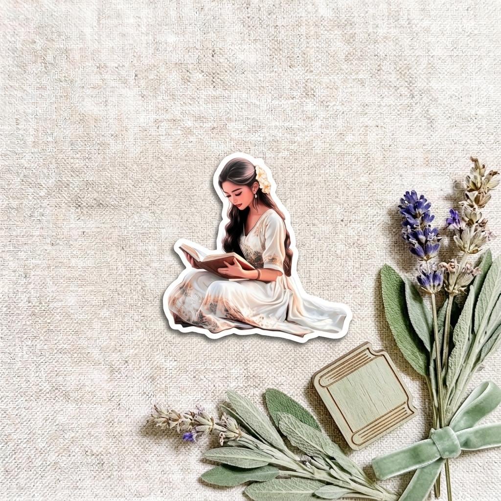 Romantic reading woman vinyl sticker of a woman in a white dress reading a book, arranged on a linen background with sprigs of lavender, sage leaves, dried flowers and a sage green ribbon. __etsy:8182152781