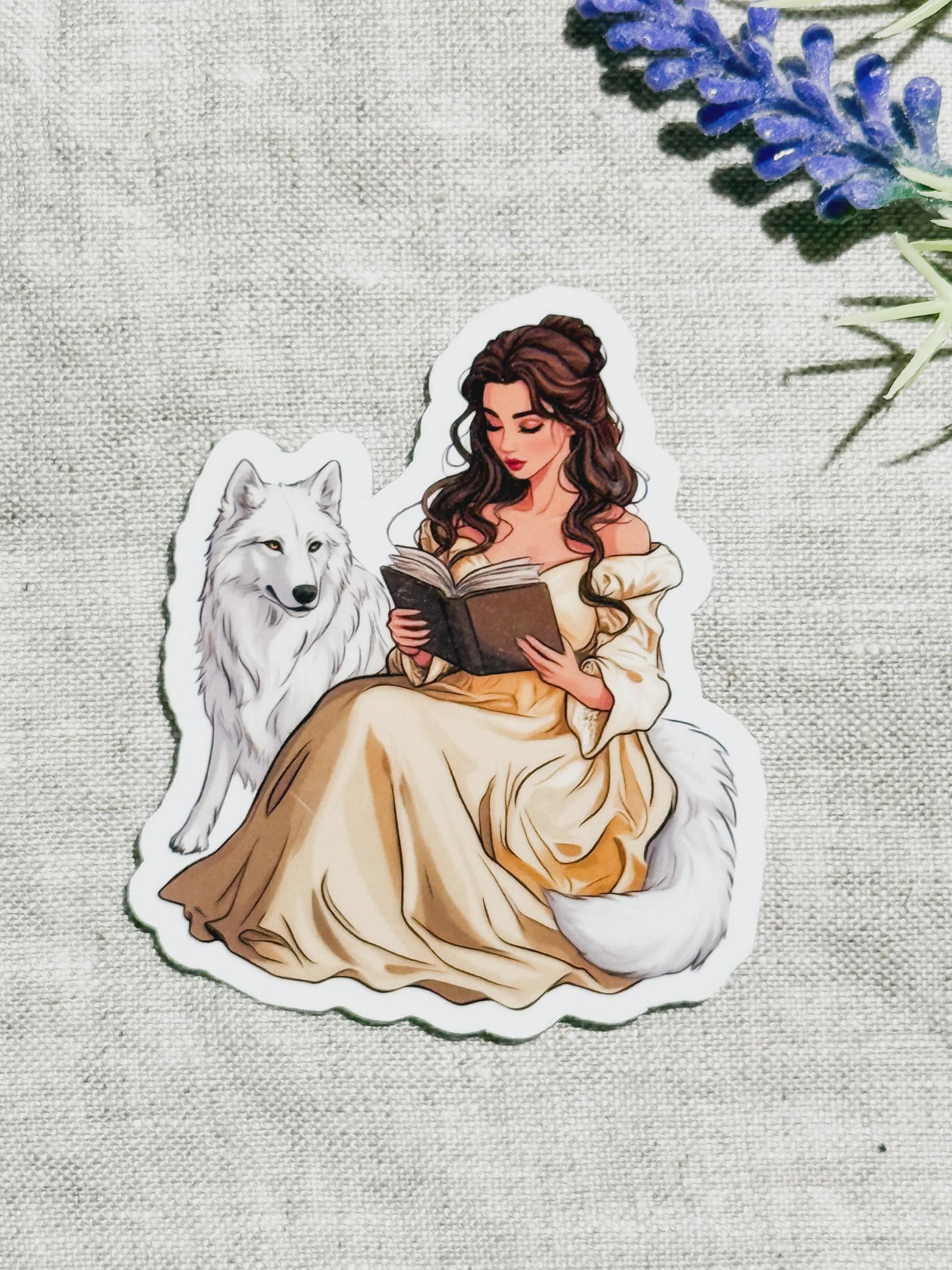 Bookish sticker of a girl in a gold dress reading with a white wolf, by The Sticker Era __etsy:8189196245