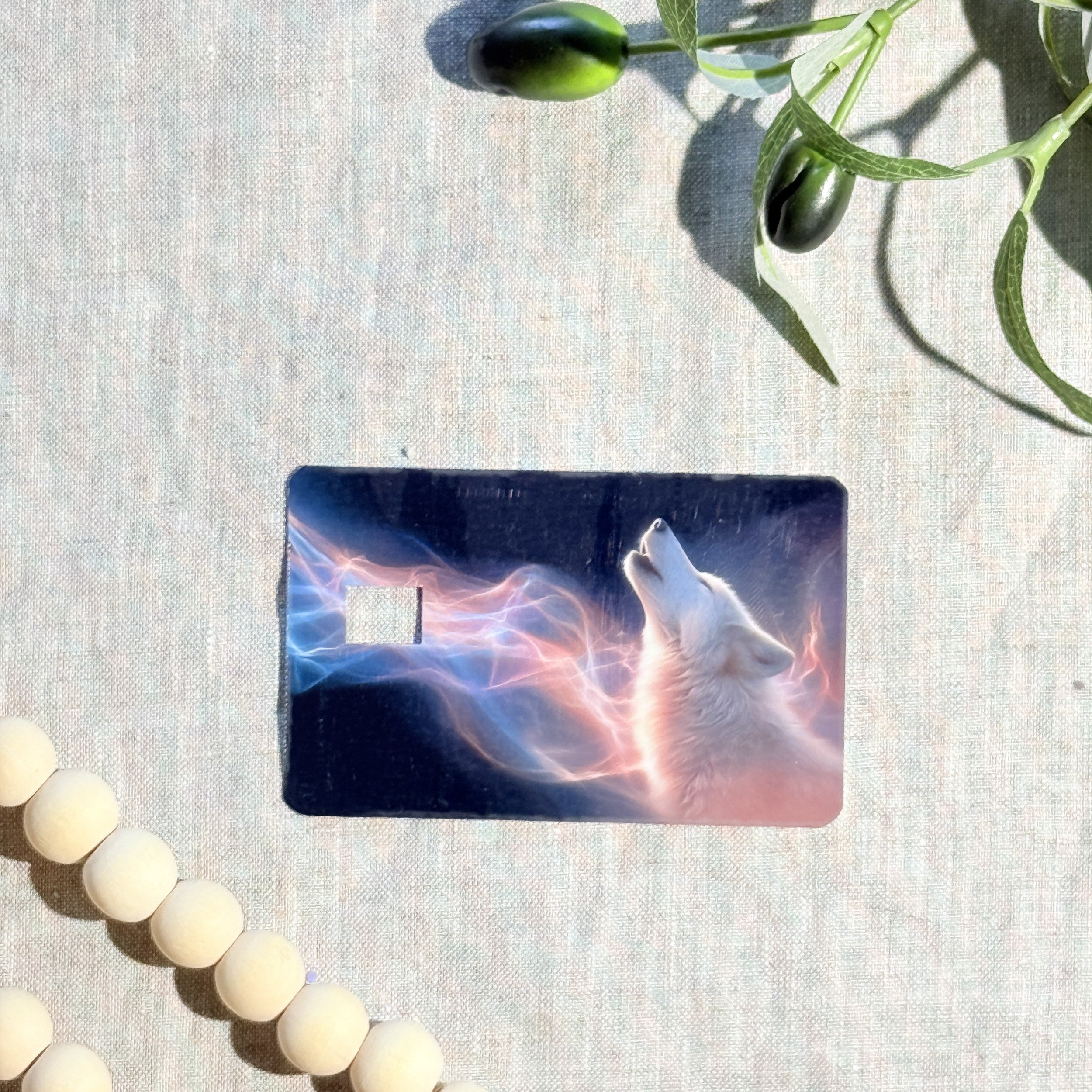 Close-up of pink and blue aurora ribbons on the wolf card skin by The Sticker Era