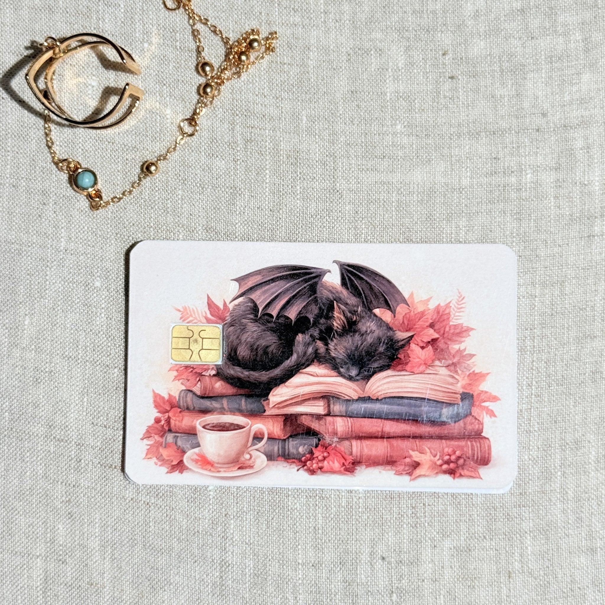 Close up of the winged cat and teacup detail with the chip cutout