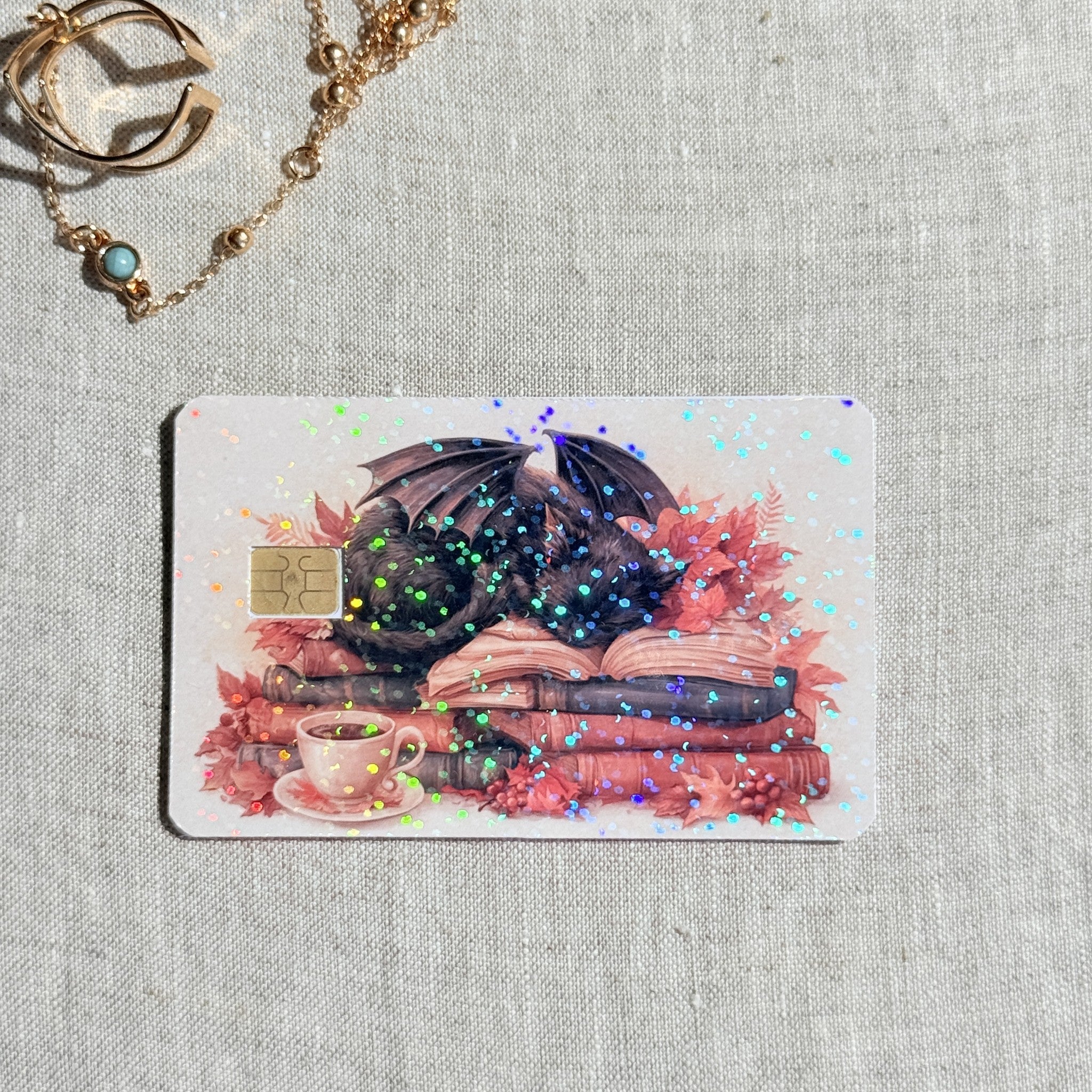 Sparkle finish autumn dragon cat card skin catching holographic glitter in the light