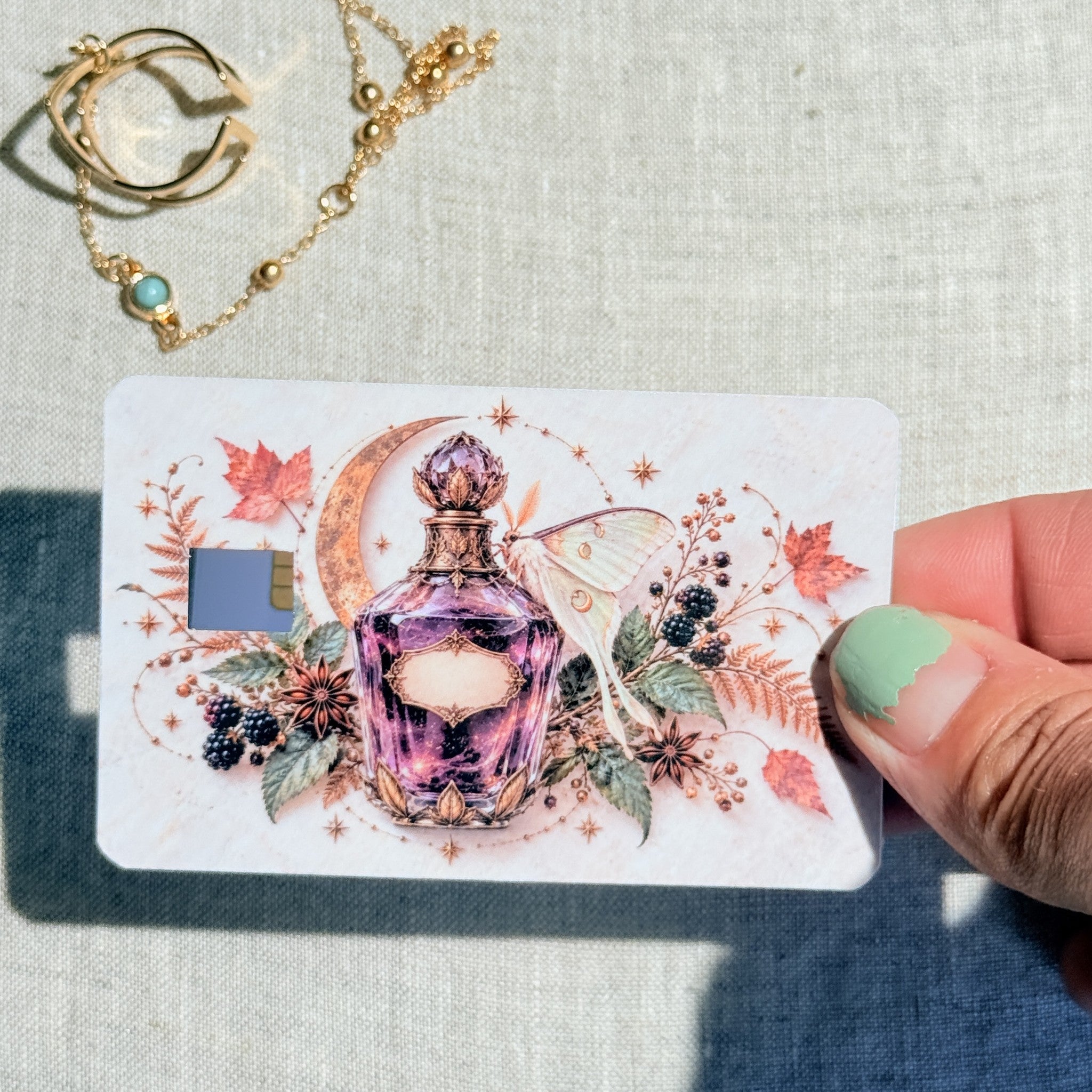 Autumn potion card skin held in hand for scale