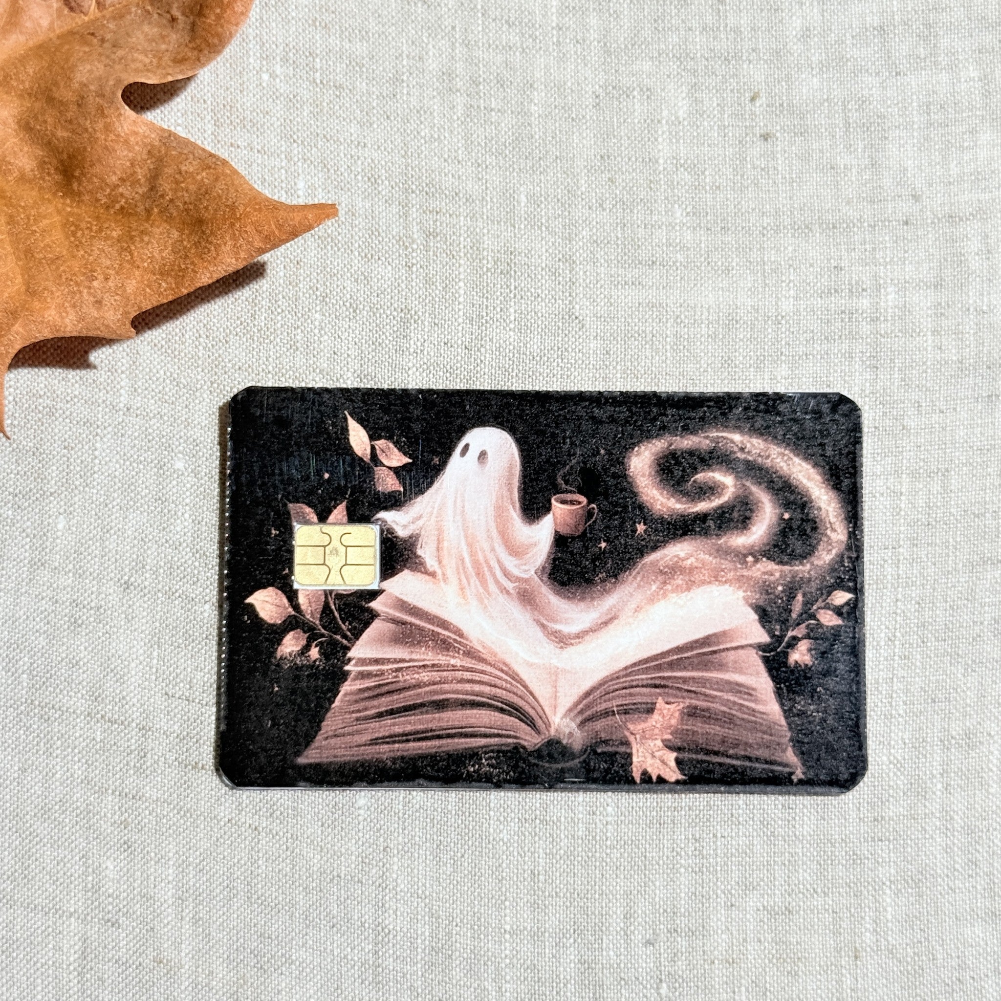 Close up of the ghost and open book design with the chip cutout