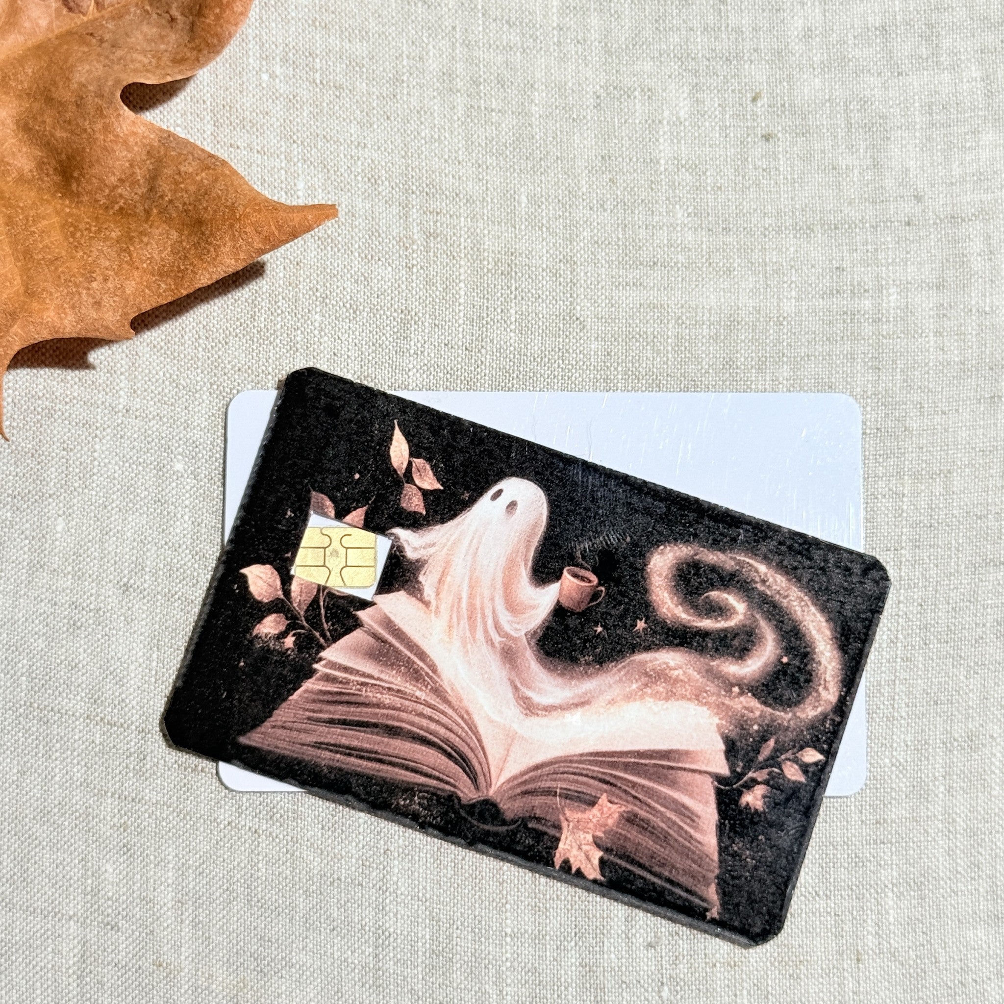 Two book ghost card skins stacked to show the standard and sparkle finishes