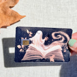 Book ghost card skin held in hand for scale