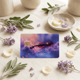 Galaxy violin card skin surrounded by lilac blooms, petals and ceramic dishes on fabric BY THE STICKER ERA