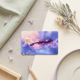 Purple violin card skin on two-tone linen with dried florals, wooden pencil and rimmed plate BY THE STICKER ERA