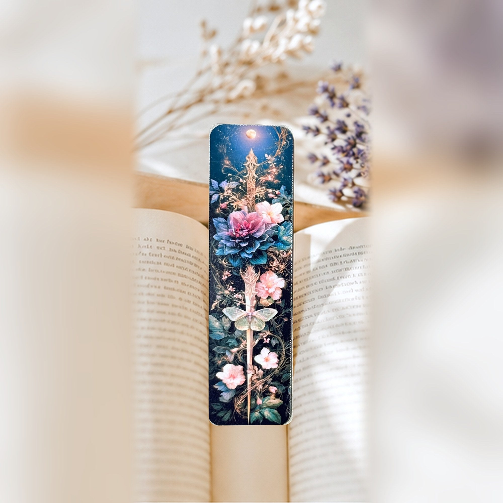Dagger bookmark in an open book by The Sticker Era