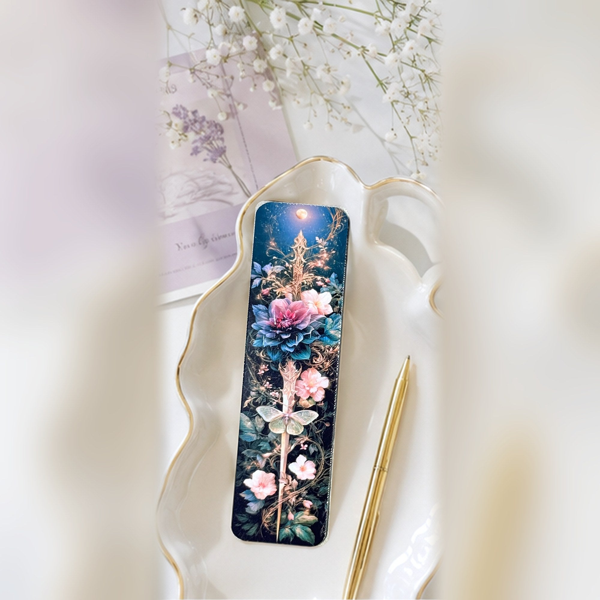 Dagger bookmark on a gold rim tray by The Sticker Era