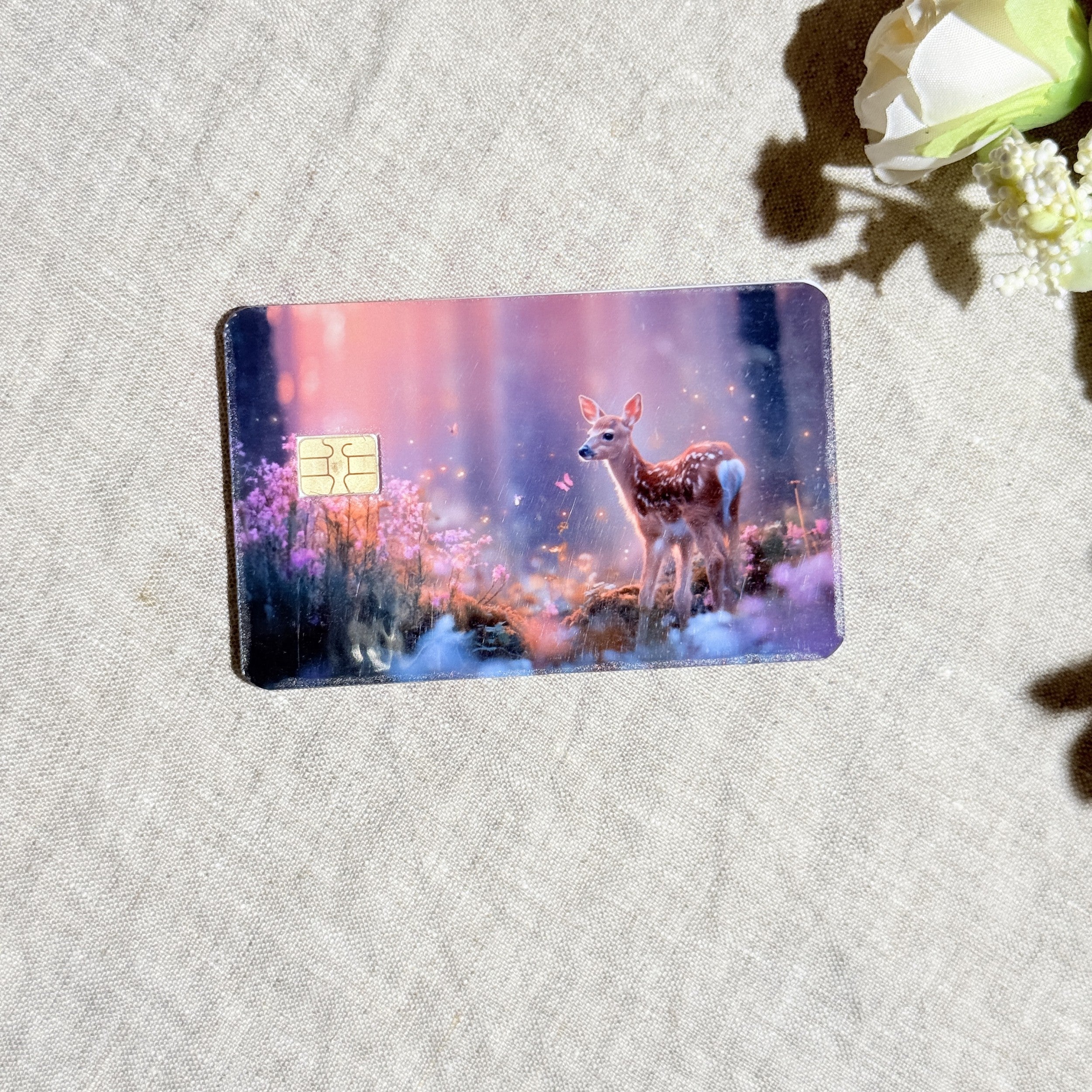 Close-up of the fawn and glowing wildflowers on the card skin by The Sticker Era