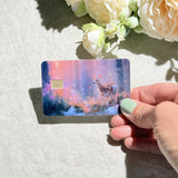 Enchanted fawn credit card sticker held at an angle by The Sticker Era