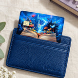 Enchanted storybook card skin tucked into a navy leather cardholder with baby's breath and a star charm by The Sticker Era