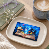Enchanted storybook card skin on a cream tray beside a latte and lavender reading glasses by The Sticker Era