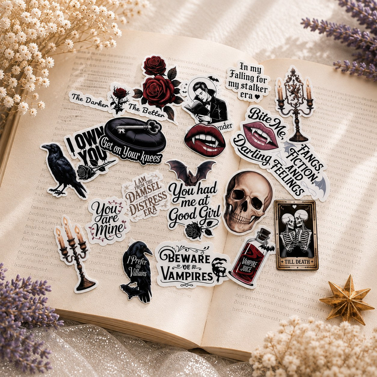 Dark romance gothic vampire sticker pack spread on an open book by The Sticker Era