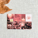 Fireside autumn card skin on a debit card, deep red collage of firelight candles and blankets