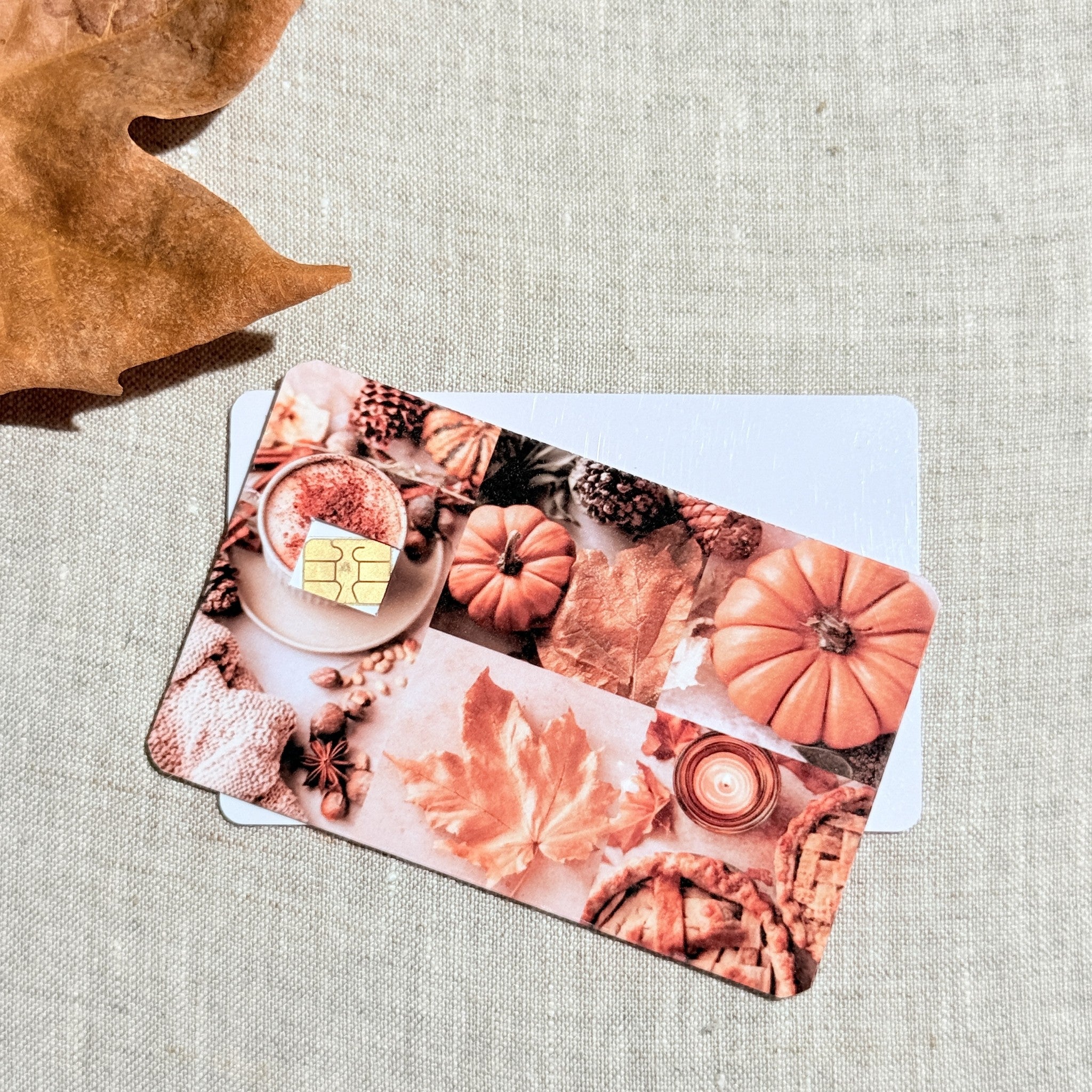 Two pumpkin season card skins stacked to show the standard and sparkle finishes