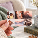 Fall vibes collage card skin held up in a cozy reading chair with a coffee mug and autumn leaves by The Sticker Era