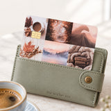 Fall vibes card skin tucked into a sage green wallet beside a latte by The Sticker Era