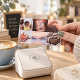 Hand holding the fall vibes card skin at a card reader in a cozy cafe by The Sticker Era