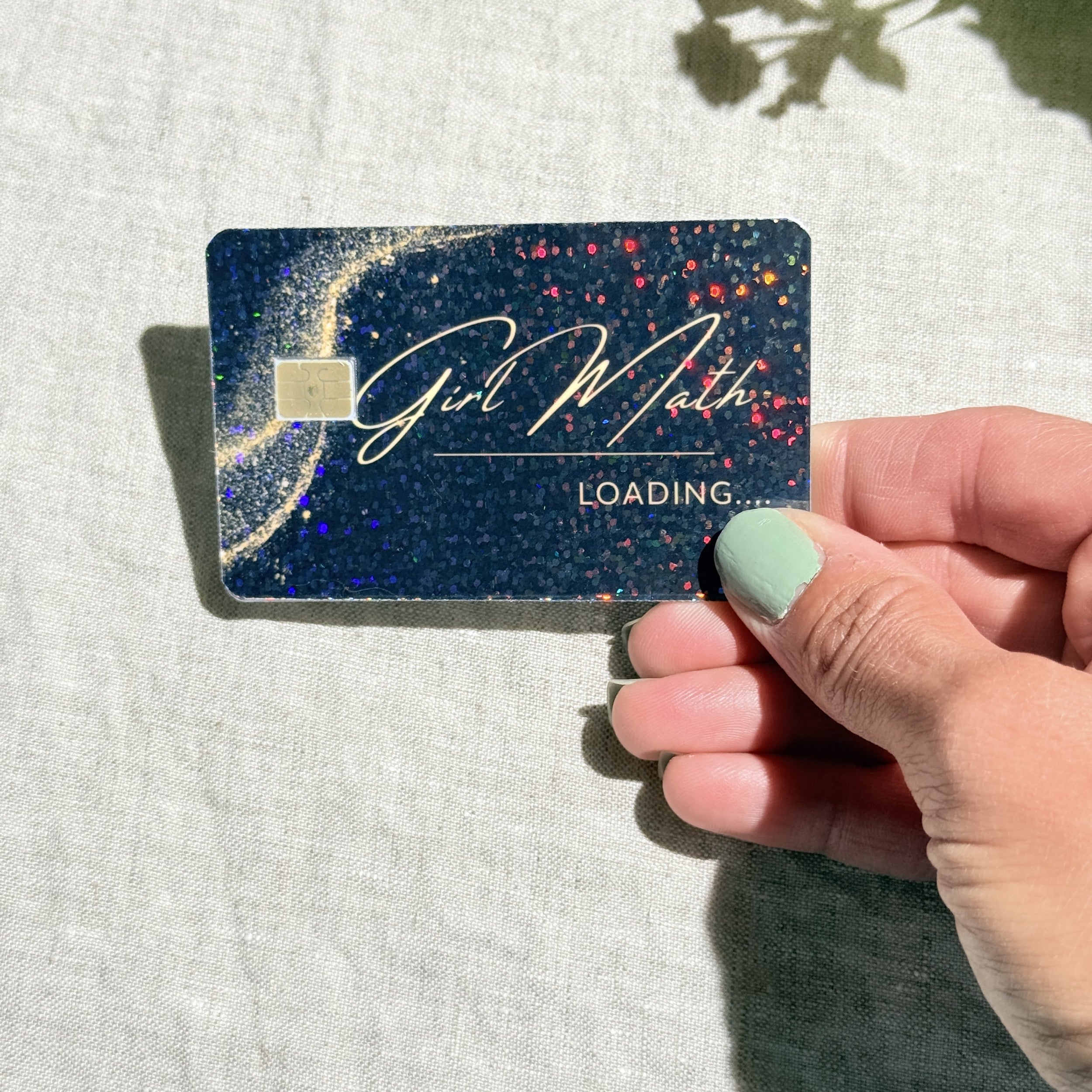 Close-up of gold dust and rainbow sparkle on the Girl Math card skin by The Sticker Era