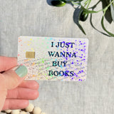 I Just Wanna Buy Books card skin held at an angle by The Sticker Era