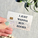Hand holding the standard finish book lover card skin by The Sticker Era