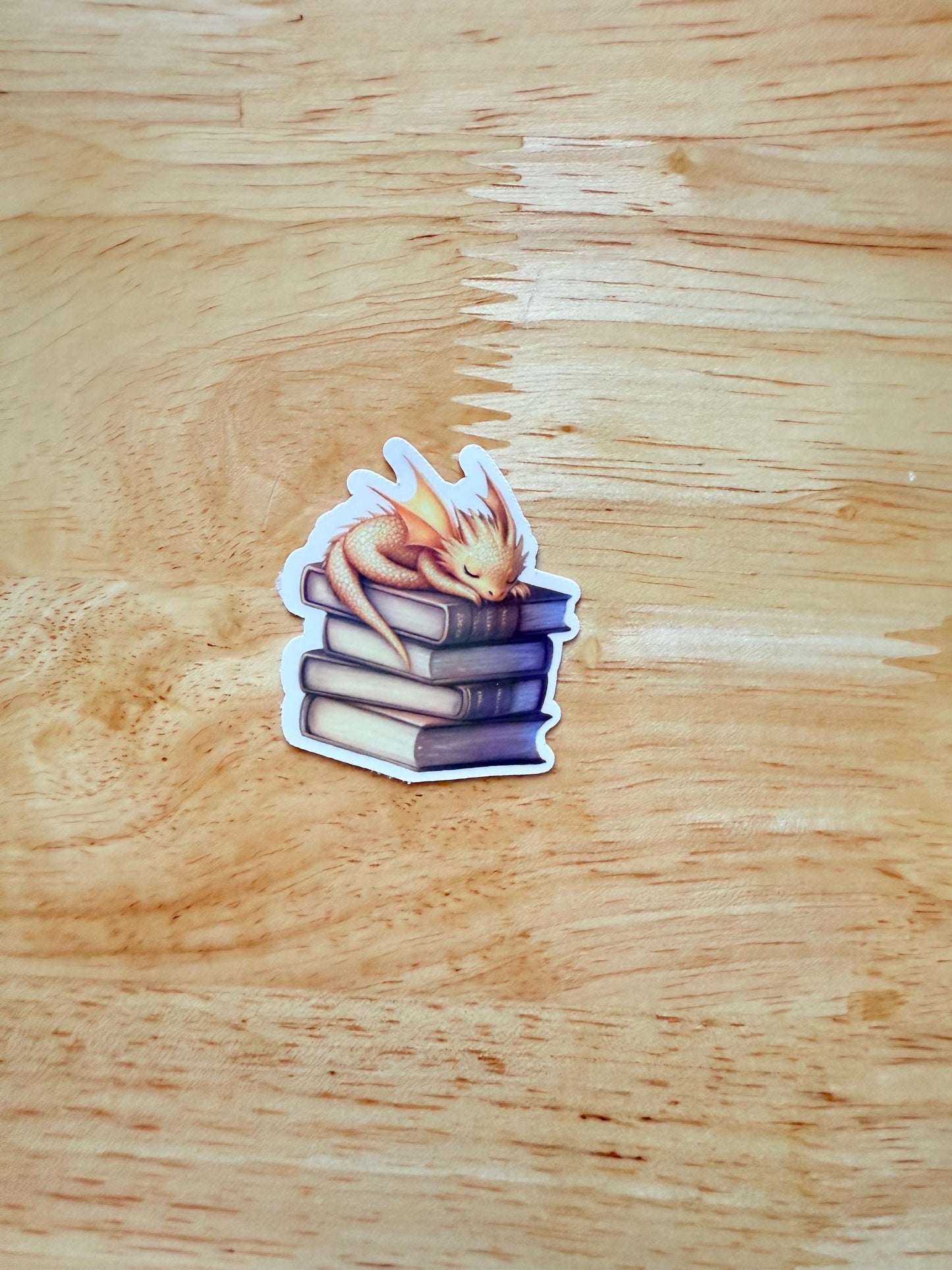 Andarna inspired gold dragon sticker curled on books – fantasy vinyl decal