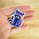 Galaxy Raccoon Sticker – Cosmic Vinyl Decal by The Sticker Era