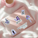 Lavender reading journal decorated with Powerless-inspired Kai Azer and dagger stickers, romantasy vinyl bundle, by The Sticker Era