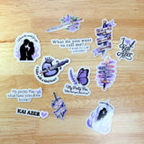 Full Powerless-inspired sticker set displayed on a wooden surface — 11-piece romantasy vinyl bundle, by The Sticker Era