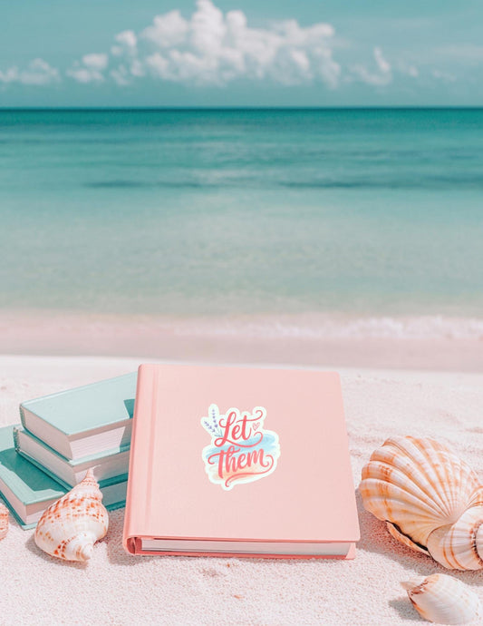 Vinyl sticker with retro-style font reading “Let Them” on a soft ocean background, placed on a laptop. Perfect for beach lovers, summer aesthetic fans, and motivational quotes.