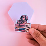 Dachshund on Books Sticker | Cute Bookish Dog Vinyl Decal by The Sticker Era