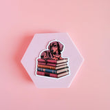 Dachshund on Books Sticker | Cute Bookish Dog Vinyl Decal by The Sticker Era