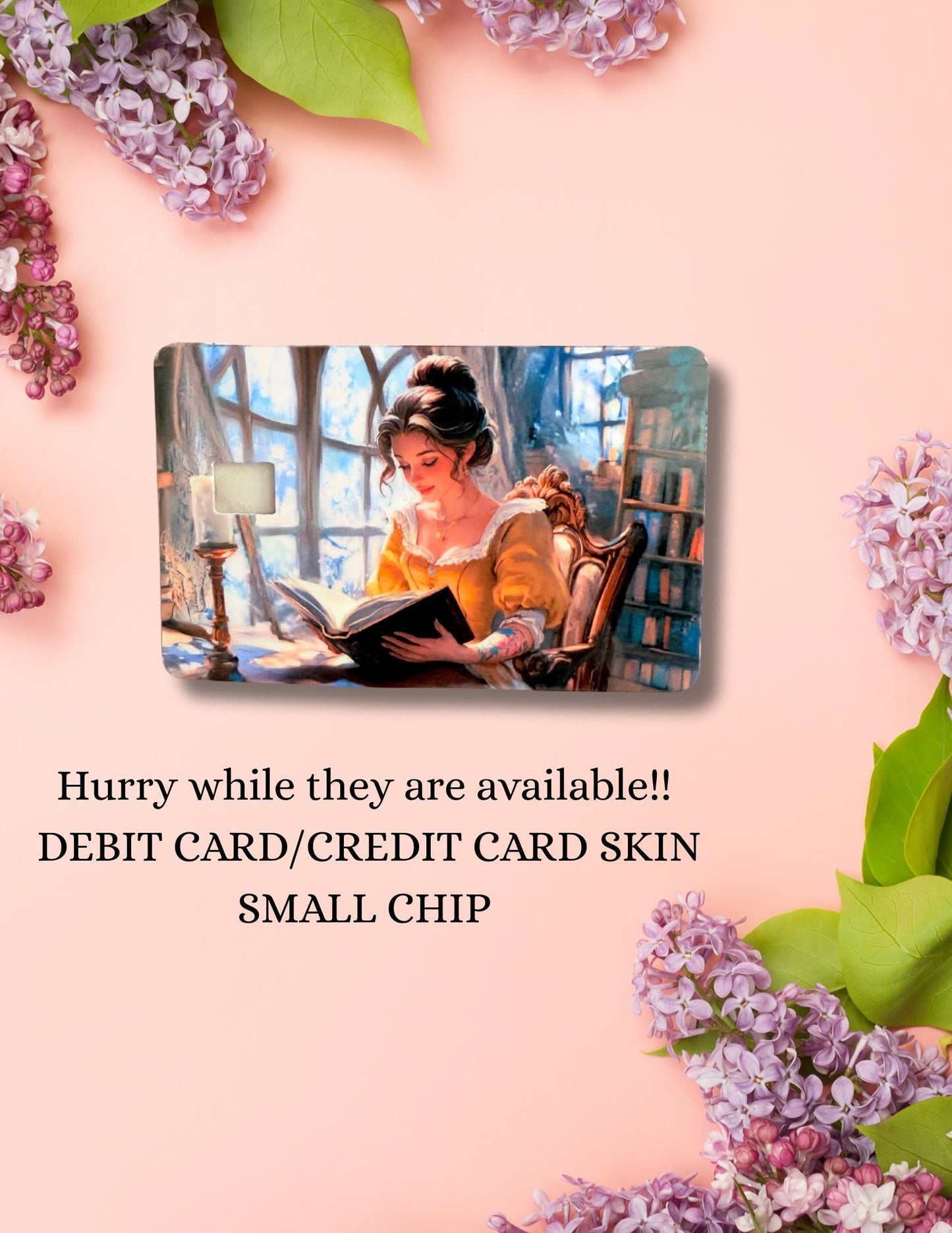 An Etsy product listing image featuring a debit card skin with an illustration of a woman in a yellow dress reading a book in a cozy, book-filled room. The card is centered on a peach background adorned with purple lilacs. Below the card, the text reads: "Hurry while they are available!! DEBIT CARD/CREDIT CARD SKIN SMALL CHIP." The scene conveys a romantic, literary aesthetic.